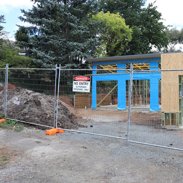 do you deliver and set up temporary fencing and what's the cost for these services in Charlestown Massachusetts